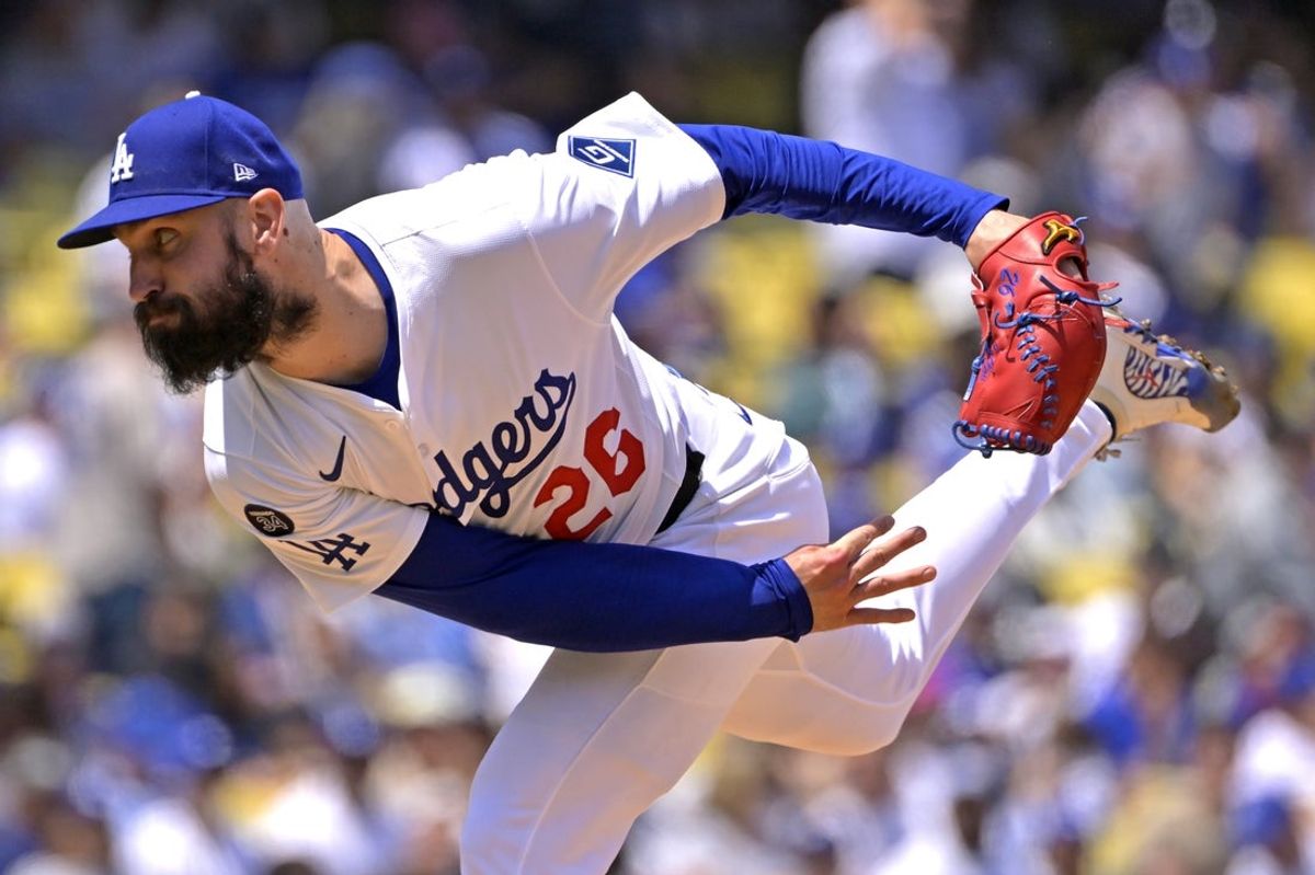 Apr 30, 2025; Los Angeles, California, USA;  Los Angeles Dodgers starting pitcher Tony Gonsolin (26) delivers to the plate in the fourth inning against the Miami Marlins at Dodger Stadium. Mandatory Credit: Jayne Kamin-Oncea-Imagn Images