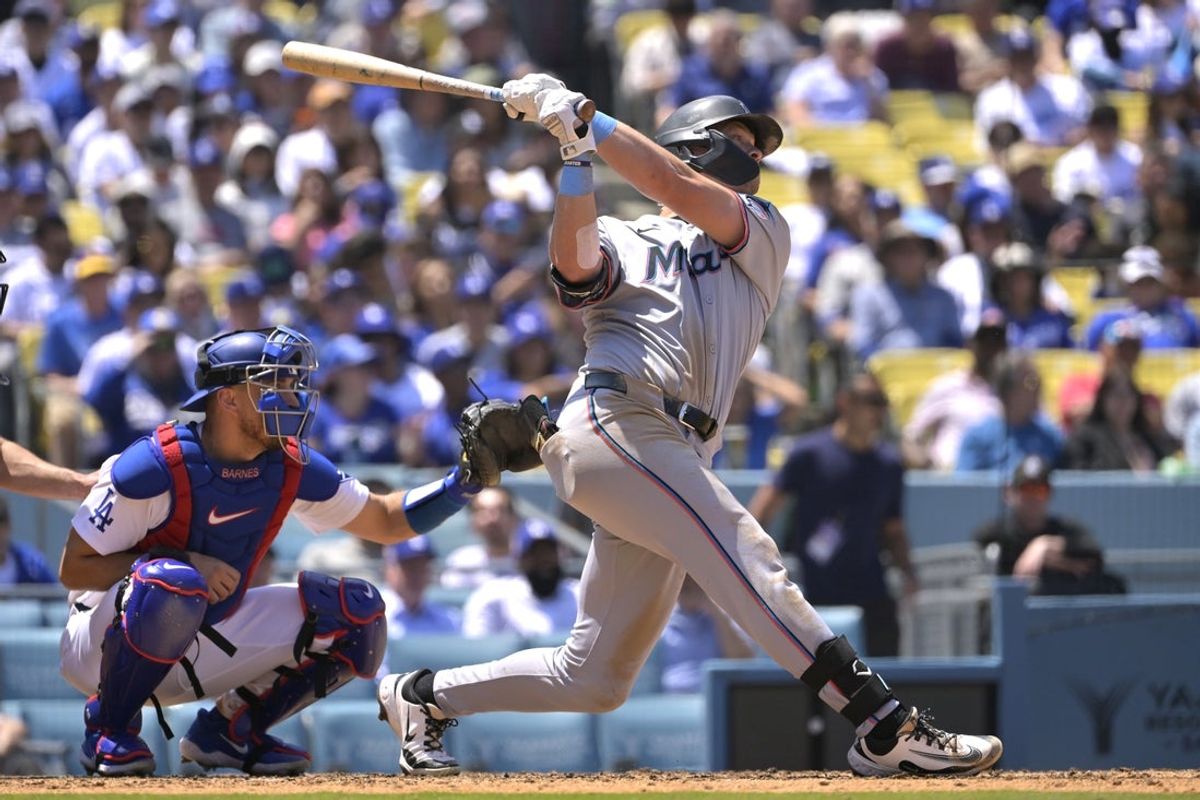 Apr 30, 2025; Los Angeles, California, USA;  Miami Marlins right fielder Kyle Stowers (28) doubles in a run in the sixth inning against the Los Angeles Dodgers at Dodger Stadium. Mandatory Credit: Jayne Kamin-Oncea-Imagn Images