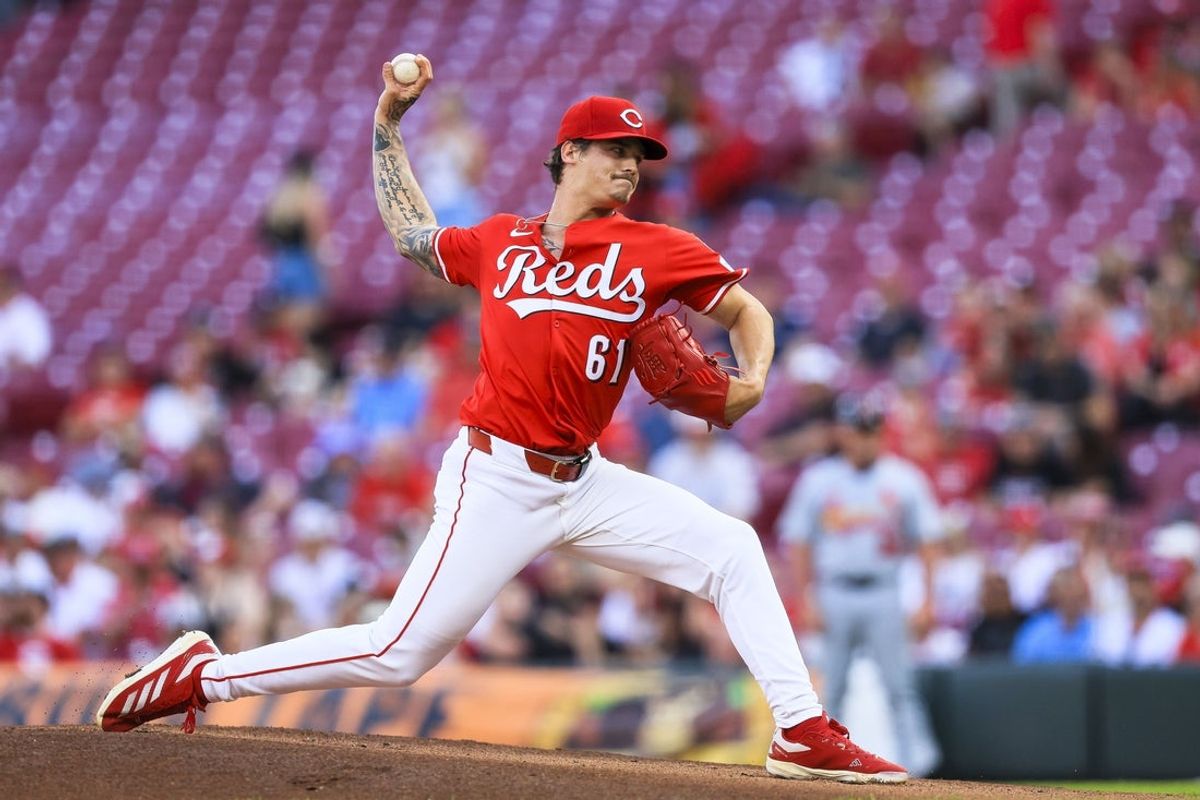 Apr 30, 2025; Cincinnati, Ohio, USA; Cincinnati Reds starting pitcher Chase Petty (61) pitches against the St. Louis Cardinals in the first inning at Great American Ball Park. Mandatory Credit: Katie Stratman-Imagn Images