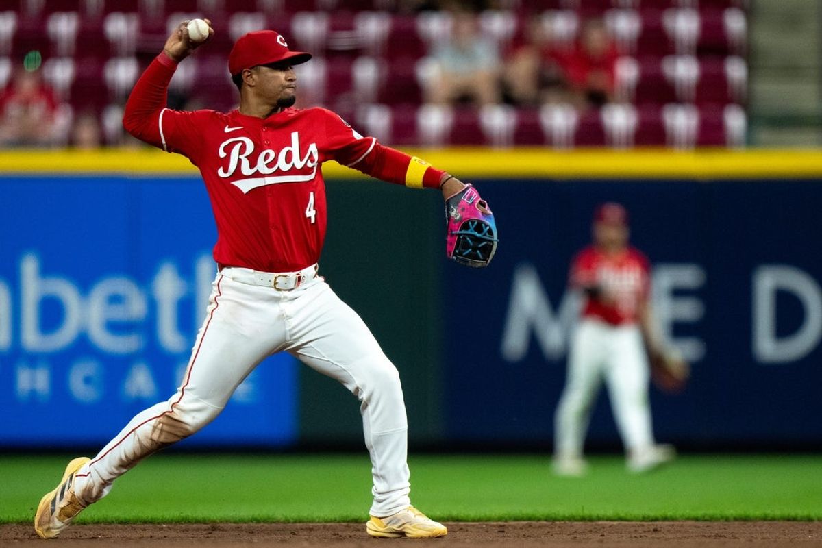 Cincinnati Reds second baseman Santiago Espinal (4) throws a runner out in the ninth inning of the MLB game between Cincinnati Reds and St. Louis Cardinals at Great American Ball Park in Cincinnati on Wednesday, April 30, 2025.