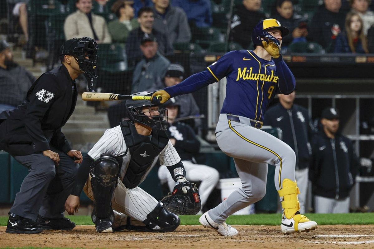Apr 30, 2025; Chicago, Illinois, USA; Milwaukee Brewers left fielder Jake Bauers (9) hits a two-run double against the Chicago White Sox during the eight inning at Rate Field. Mandatory Credit: Kamil Krzaczynski-Imagn Images