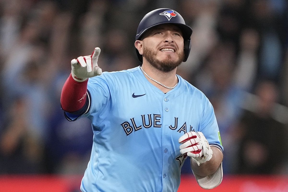 Apr 30, 2025; Toronto, Ontario, CAN; Toronto Blue Jays catcher Alejandro Kirk (30) reacts as he runs to first base on his RBI walk-off single against the Boston Red Sox during the tenth inning at Rogers Centre. Mandatory Credit: John E. Sokolowski-Imagn Images