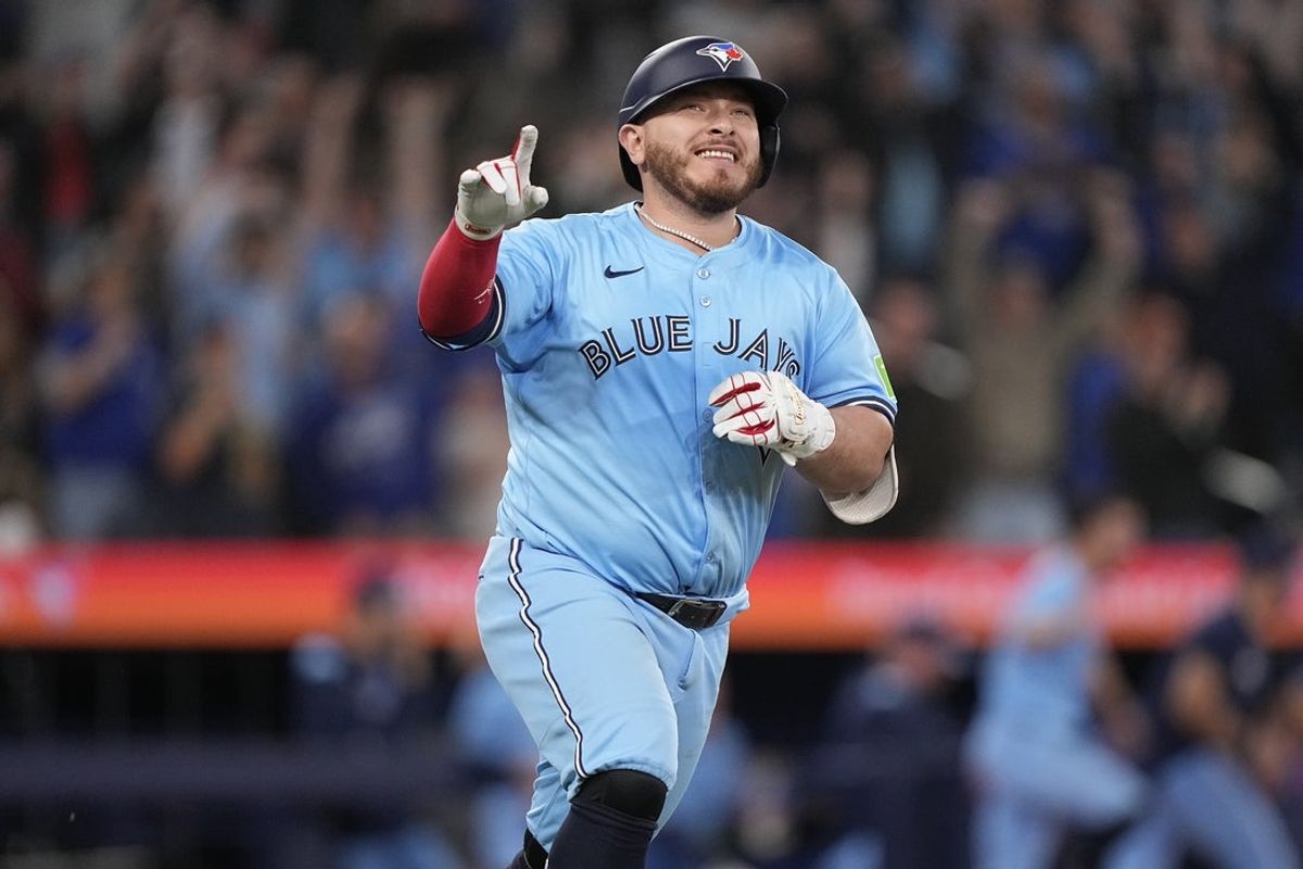 Apr 30, 2025; Toronto, Ontario, CAN; Toronto Blue Jays catcher Alejandro Kirk (30) reacts as he runs to first base on his RBI walk-off single against the Boston Red Sox during the tenth inning at Rogers Centre. Mandatory Credit: John E. Sokolowski-Imagn Images