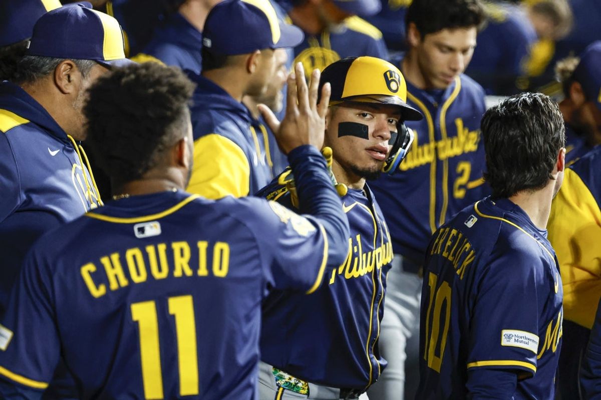 Apr 30, 2025; Chicago, Illinois, USA; Milwaukee Brewers catcher William Contreras (24) celebrates with teammates after scoring against the Chicago White Sox during the eight inning at Rate Field. Mandatory Credit: Kamil Krzaczynski-Imagn Images
