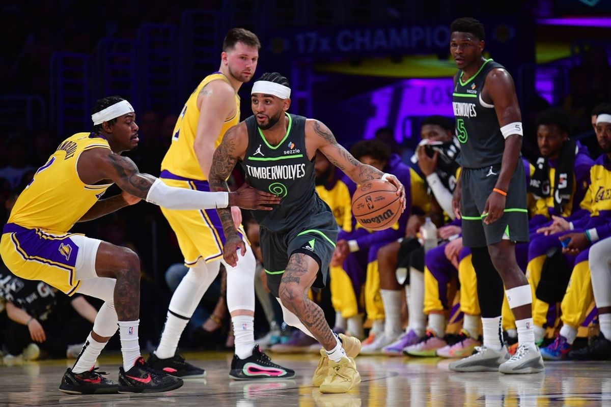 Apr 30, 2025; Los Angeles, California, USA; Minnesota Timberwolves guard Nickeil Alexander-Walker (9) moves the ball against Los Angeles Lakers forward Jarred Vanderbilt (2) during the first half in game five of first round for the 2025 NBA Playoffs at Crypto.com Arena. Mandatory Credit: Gary A. Vasquez-Imagn Images
