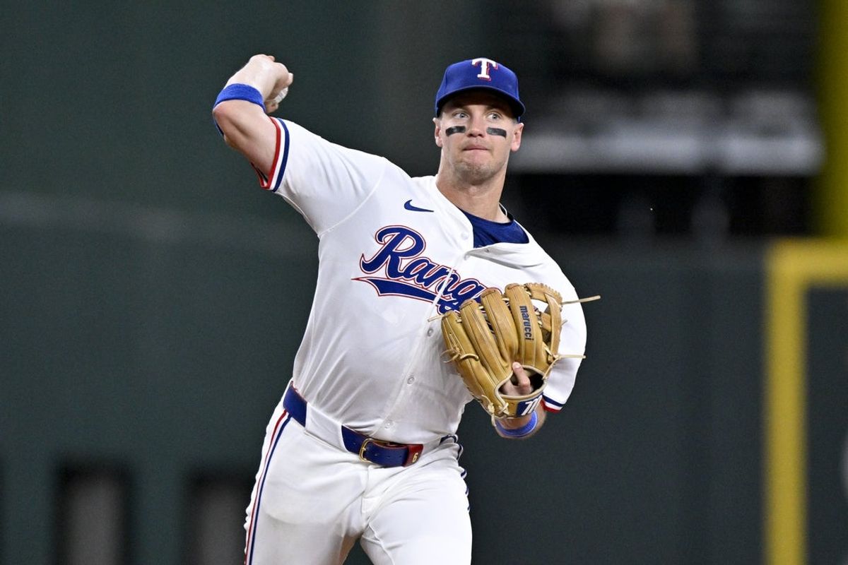 May 1, 2025; Arlington, Texas, USA; Texas Rangers third baseman Josh Jung (6) throws out Athletics catcher Jhonny Pereda (not pictured) during the fifth inning at Globe Life Field. Mandatory Credit: Jerome Miron-Imagn Images