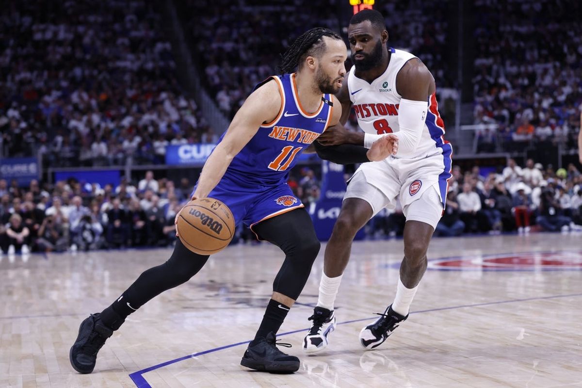 May 1, 2025; Detroit, Michigan, USA; New York Knicks guard Jalen Brunson (11) dribbles defended by Detroit Pistons forward Tim Hardaway Jr. (8) in the first half during game six of first round for the 2024 NBA Playoffs at Little Caesars Arena. Mandatory Credit: Rick Osentoski-Imagn Images