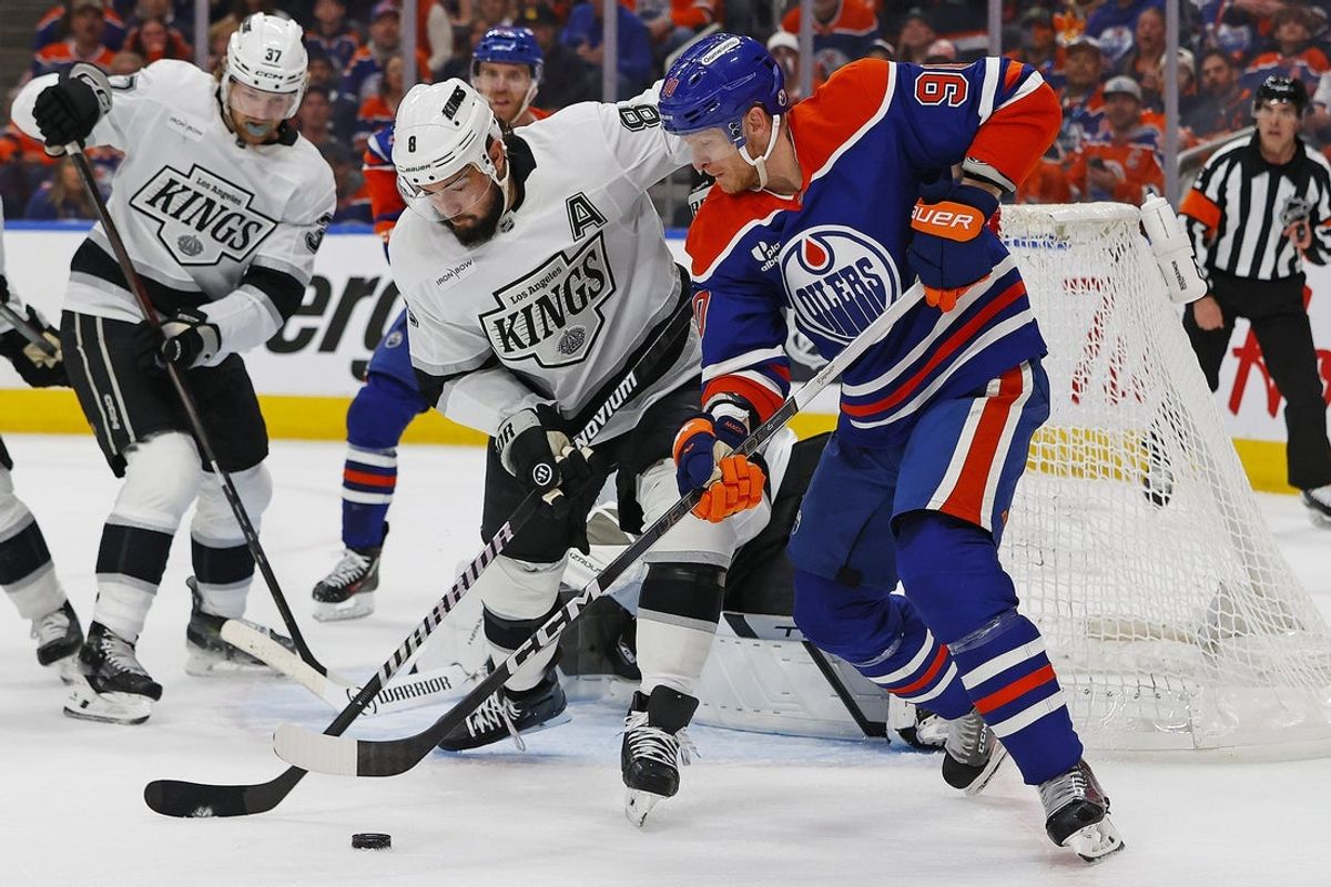 May 1, 2025; Edmonton, Alberta, CAN; Edmonton Oilers forward Corey Perry (90) battles with Los Angeles Kings defensemen Drew Doughty (8) for a loose puck during the first period in game six of the first round of the 2025 Stanley Cup Playoffs at Rogers Place. Mandatory Credit: Perry Nelson-Imagn Images