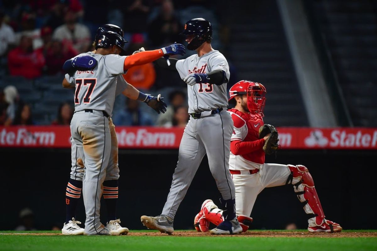 May 1, 2025; Anaheim, California, USA; Detroit Tigers catcher Dillon Dingler (13) is greeted by third baseman Andy Ibanez (77) and left fielder Zach McKinstry (39) after hitting a three run home run against the Los Angeles Angels during the eighth inning at Angel Stadium. Mandatory Credit: Gary A. Vasquez-Imagn Images