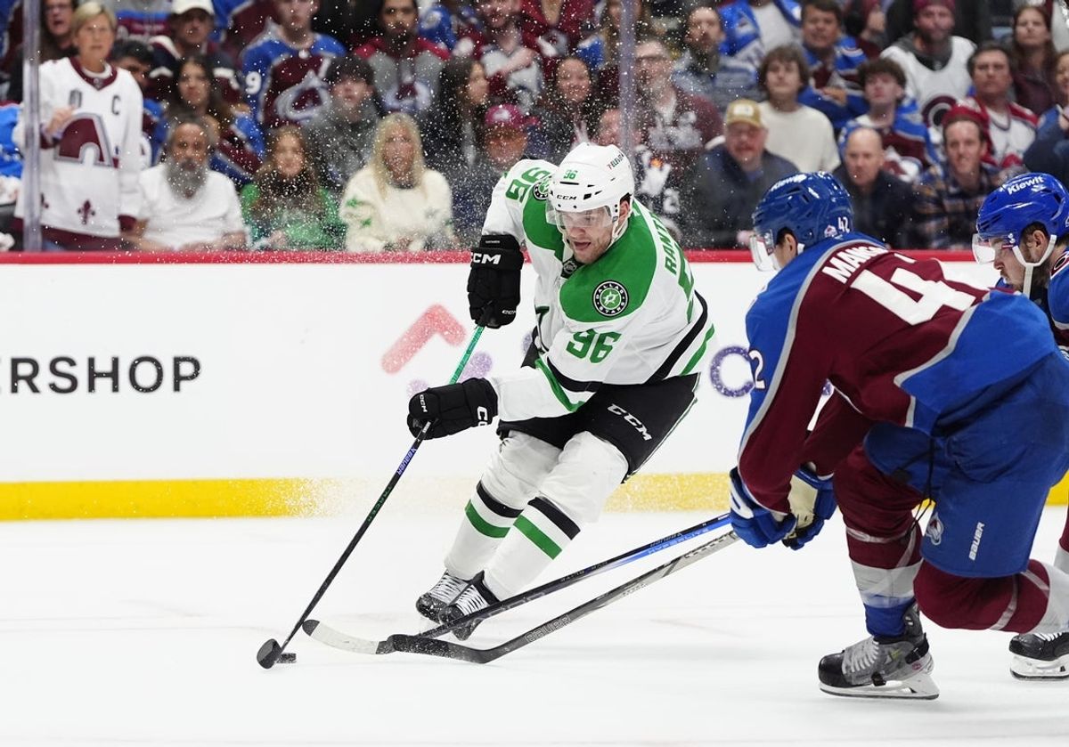 May 1, 2025; Denver, Colorado, USA; Dallas Stars right wing Mikko Rantanen (96) controls the puck against the Colorado Avalanche in the third period in game six of the first round of the 2025 Stanley Cup Playoffs at Ball Arena. Mandatory Credit: Ron Chenoy-Imagn Images
