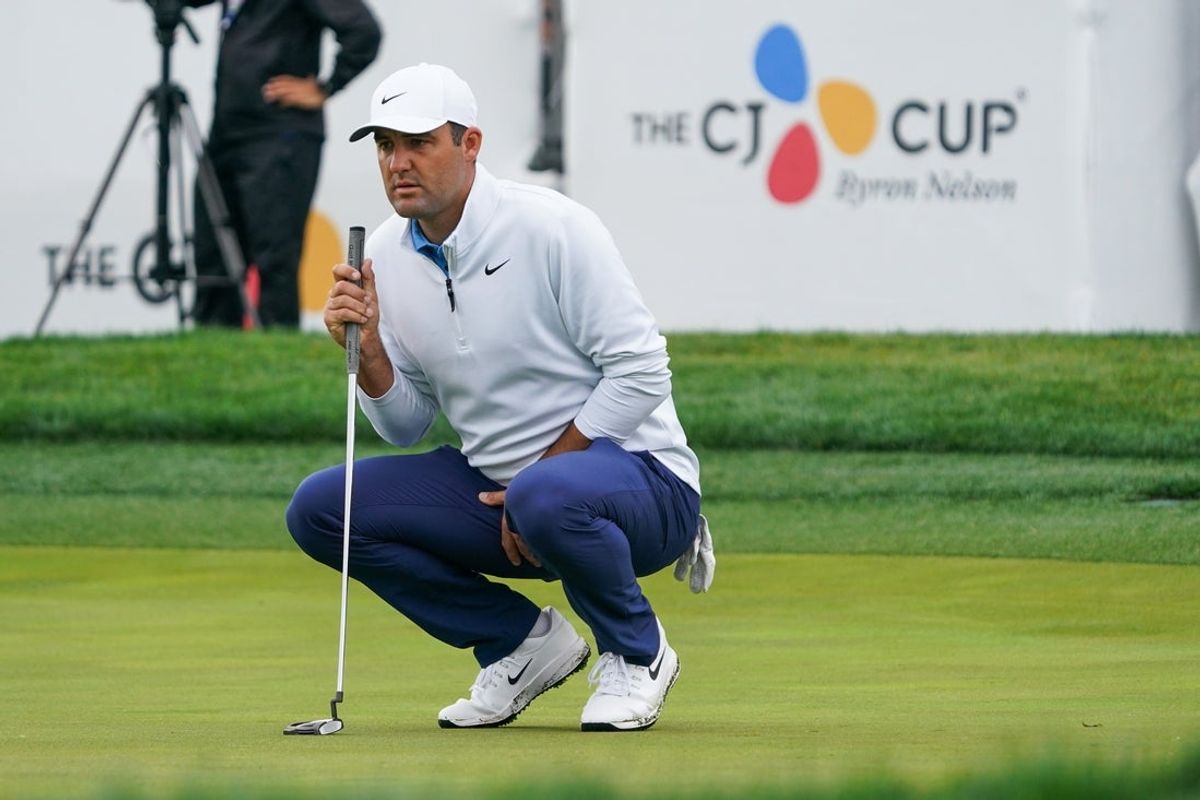 May 2, 2025; McKinney, Texas, USA; Scottie Scheffler lines up a putt on the 18th green during the second round of the THE CJ CUP Byron Nelson golf tournament. Mandatory Credit: Raymond Carlin III-Imagn Images