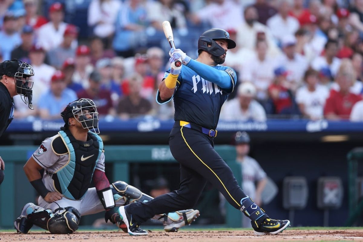 May 2, 2025; Philadelphia, Pennsylvania, USA; Philadelphia Phillies outfielder Kyle Schwarber (12) hits an RBI double against the Arizona Diamondbacks during the first inning at Citizens Bank Park. Mandatory Credit: Bill Streicher-Imagn Images