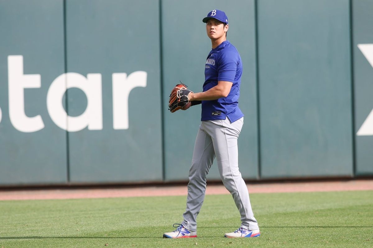 May 2, 2025; Atlanta, Georgia, USA;  Los Angeles Dodgers designated hitter Shohei Ohtani (17) throws before a game against the Atlanta Braves at Truist Park. Mandatory Credit: Brett Davis-Imagn Images