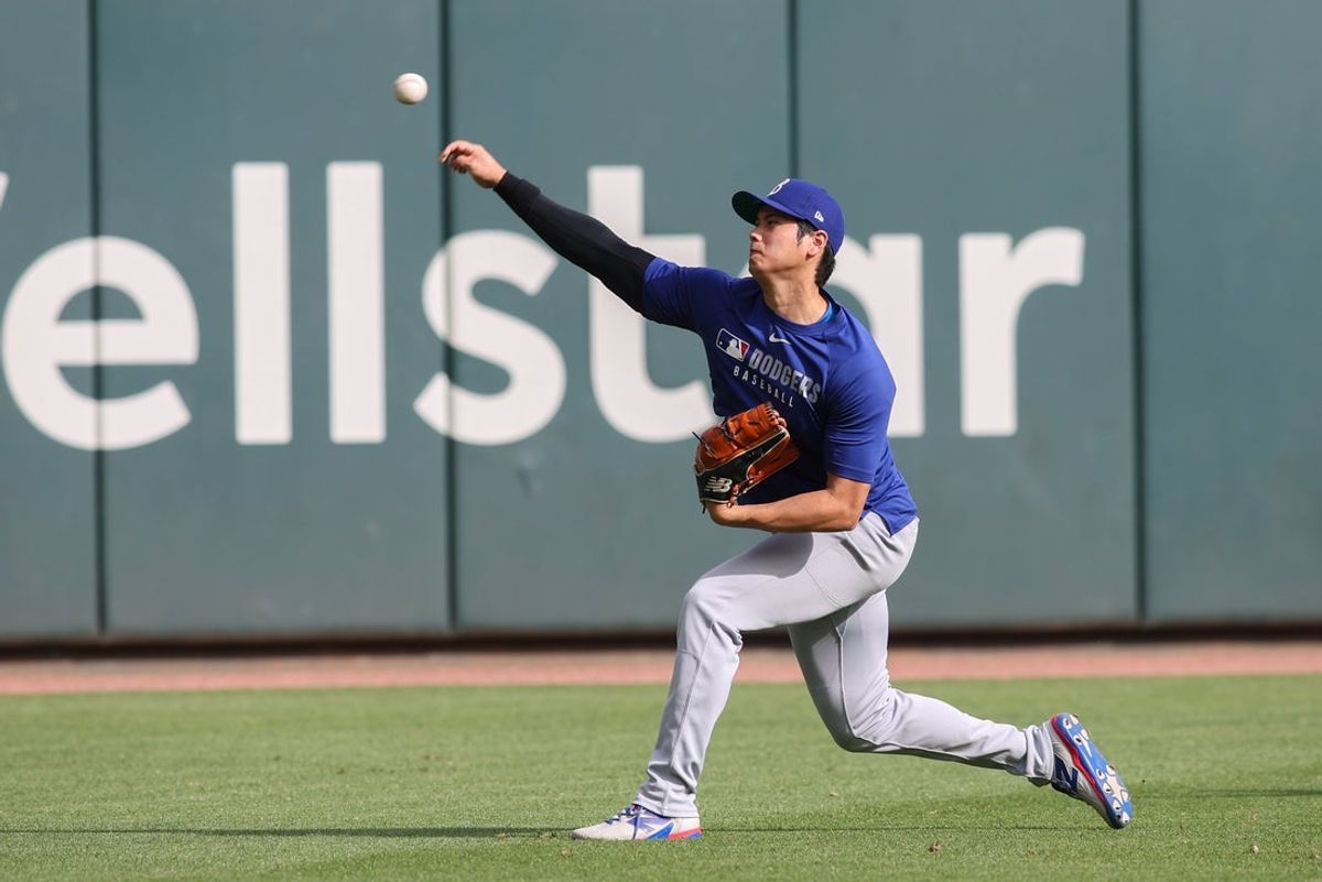 May 2, 2025; Atlanta, Georgia, USA;  Los Angeles Dodgers designated hitter Shohei Ohtani (17) throws before a game against the Atlanta Braves at Truist Park. Mandatory Credit: Brett Davis-Imagn Images
