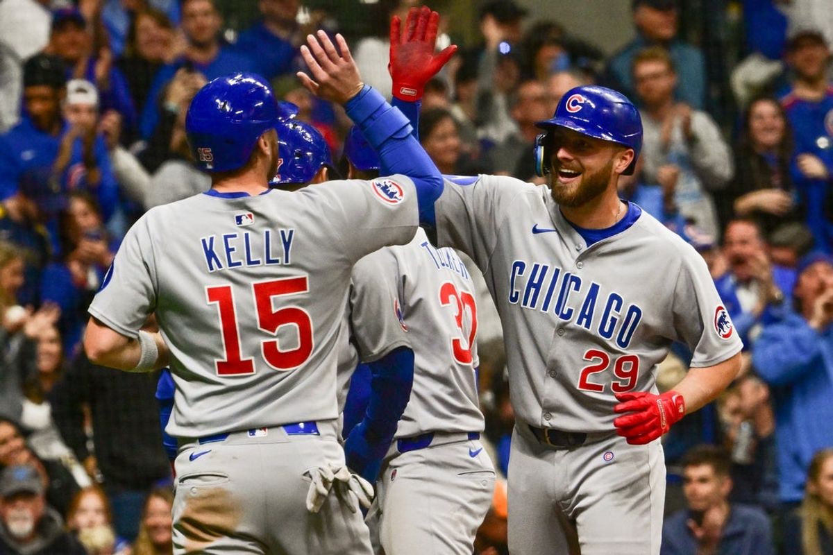 May 2, 2025; Milwaukee, Wisconsin, USA; Chicago Cubs first baseman Michael Busch (29) is greeted by catcher Carson Kelly (15) after hitting a grand slam home run in the second inning against the Milwaukee Brewers at American Family Field. Mandatory Credit: Benny Sieu-Imagn Images