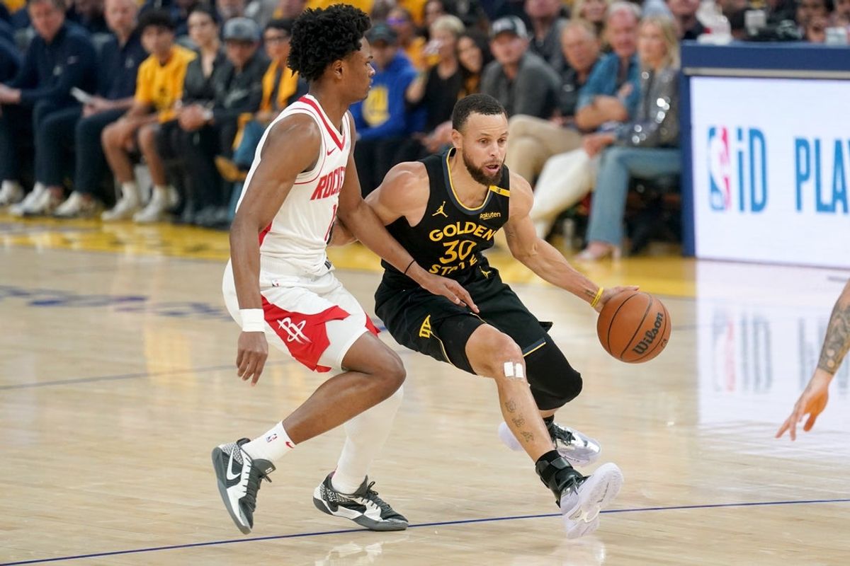May 2, 2025; San Francisco, California, USA; Golden State Warriors guard Stephen Curry (30) dribbles the ball against Houston Rockets forward Amen Thompson (1) in the first quarter of game six of the first round for the 2025 NBA Playoffs at Chase Center. Mandatory Credit: Cary Edmondson-Imagn Images