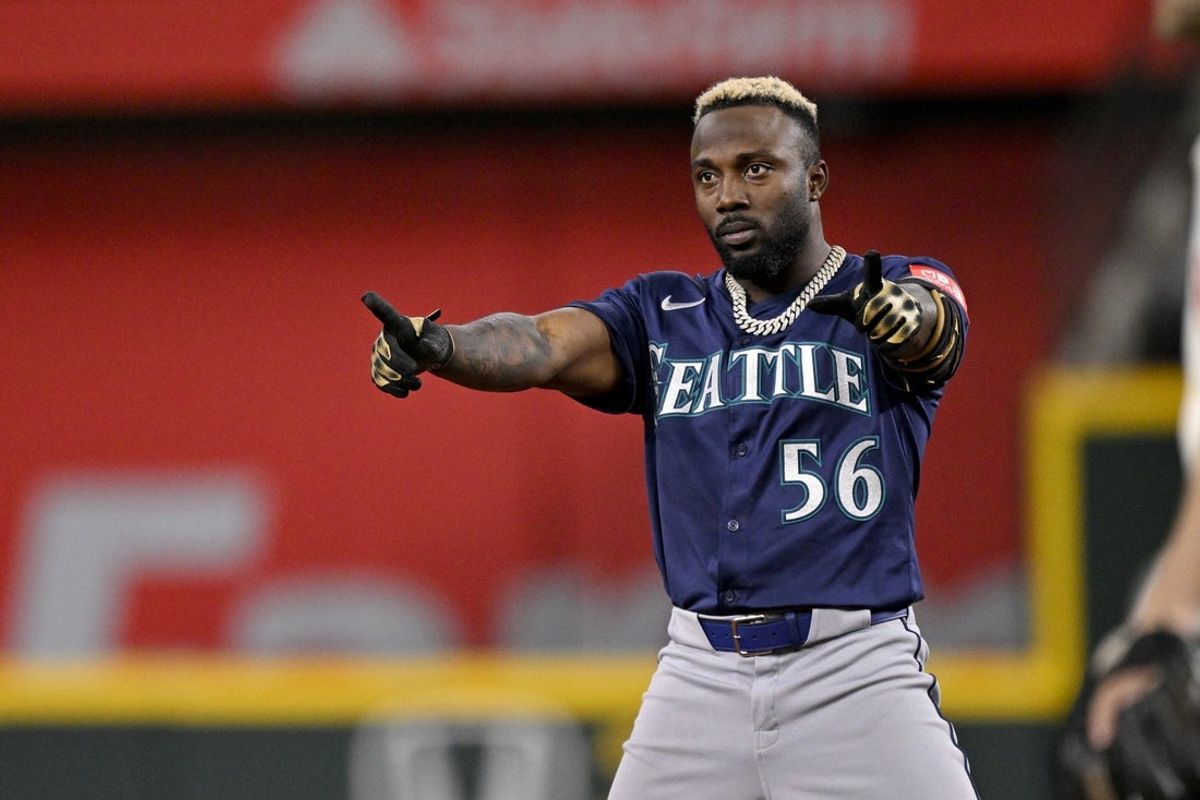 May 2, 2025; Arlington, Texas, USA; Seattle Mariners left fielder Randy Arozarena (56) points to the dugout after he hits a double against the Texas Rangers during the fifth inning at Globe Life Field. Mandatory Credit: Jerome Miron-Imagn Images