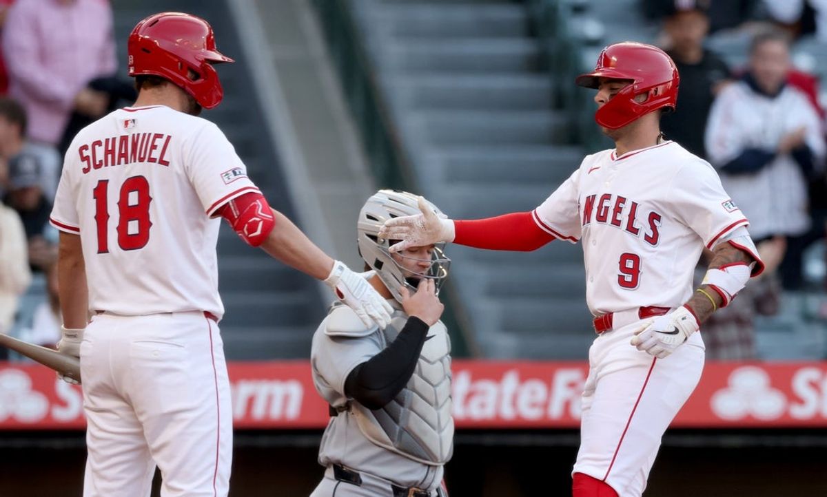 May 2, 2025; Anaheim, California, USA; Los Angeles Angels shortstop Zach Neto (9) celebrates with first baseman Nolan Schanuel (18) after hitting a home rub during the 1st inning against the Detroit Tigers at Angel Stadium. Mandatory Credit: Jason Parkhurst-Imagn Images