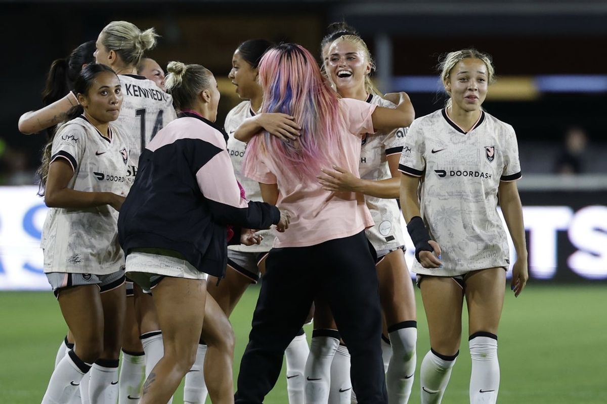 May 2, 2025; Washington, District of Columbia, USA; Angel City FC forward Riley Tiernan (33) celebrates with teammates after the final whistle against the Washington Spirit at Audi Field. Mandatory Credit: Geoff Burke-Imagn Images