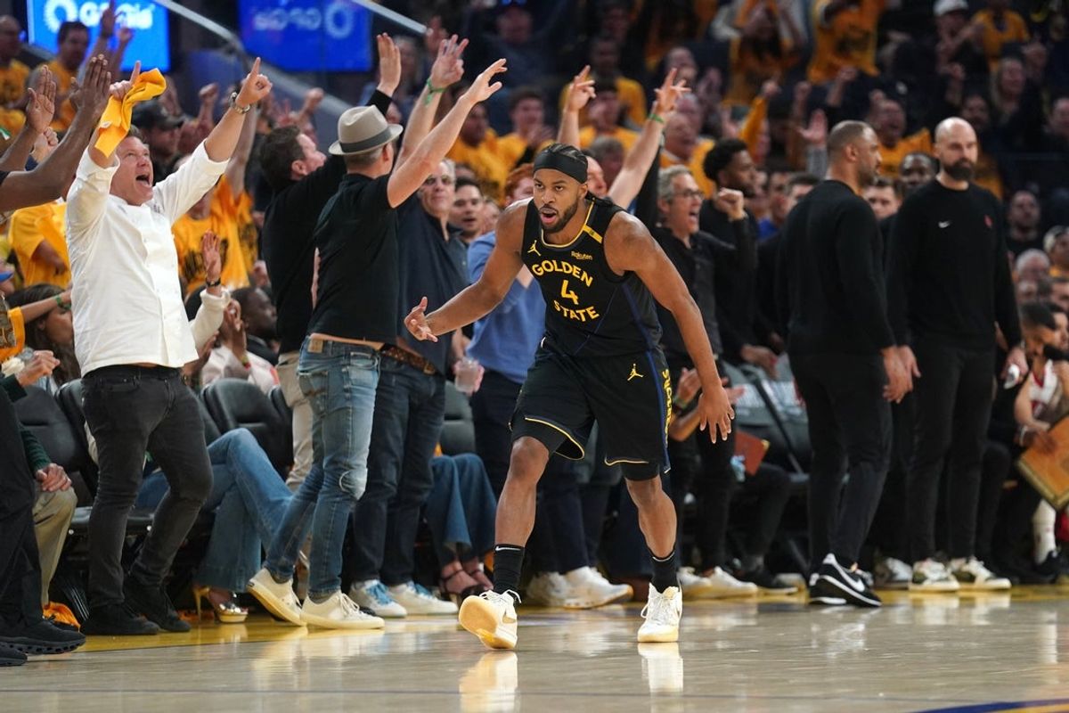 May 2, 2025; San Francisco, California, USA; Golden State Warriors guard Moses Moody (4) reacts after making a three-point basket against the Houston Rockets in the second quarter of game six of the first round for the 2025 NBA Playoffs at Chase Center. Mandatory Credit: Cary Edmondson-Imagn Images