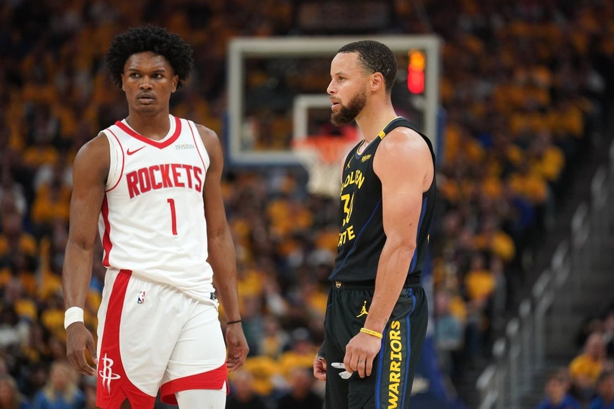 May 2, 2025; San Francisco, California, USA; Houston Rockets forward Amen Thompson (1) stands next to Golden State Warriors guard Stephen Curry (30) during a break in the action in the second quarter of game six of the first round for the 2025 NBA Playoffs at Chase Center. Mandatory Credit: Cary Edmondson-Imagn Images