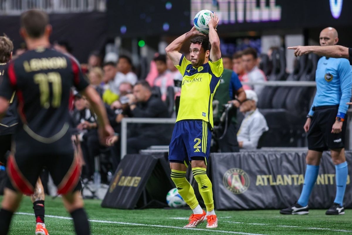 May 3, 2025; Atlanta, Georgia, USA; Nashville SC defender Daniel Lovitz (2) throws  against Atlanta United in the first half at Mercedes-Benz Stadium. Mandatory Credit: Brett Davis-Imagn Images