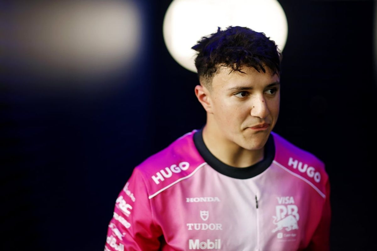 May 3, 2025; Miami Gardens, FL, USA; RB driver Isack Hadjar (6) walks out of the FIA garage after missing the final round  during qualifying for the F1 Miami Grand Prix at Miami International Autodrome. Mandatory Credit: Peter Casey-Imagn Images