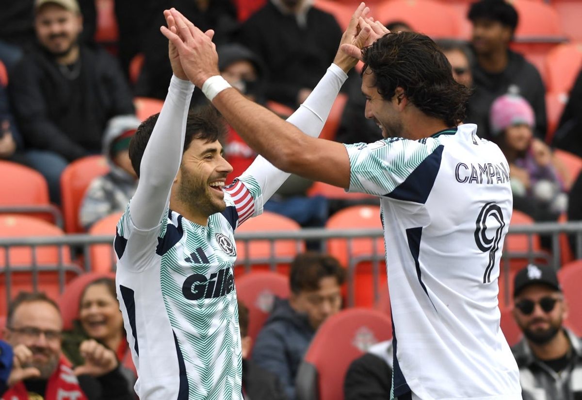 May 3, 2025; Toronto, Ontario, CAN;   New England Revolution midfielder Carles Gil (10) celebrates with forward Leo Campana (9) after scoring a goal against Toronto FC in the first half at BMO Field. Mandatory Credit: Dan Hamilton-Imagn Images