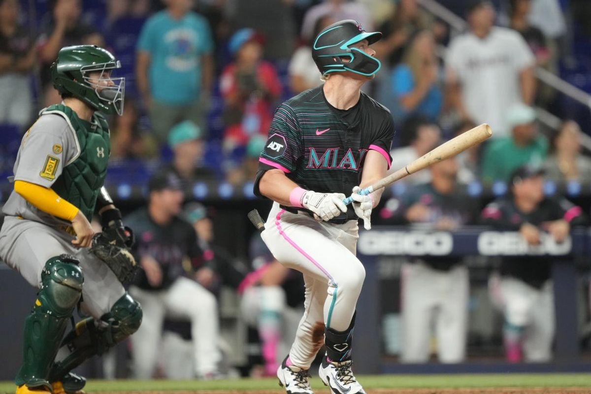 May 3, 2025; Miami, Florida, USA;  Miami Marlins right fielder Kyle Stowers (28) hits a walk-off grand slam against the Oakland Athletics in the ninth inning at loanDepot Park. Mandatory Credit: Jim Rassol-Imagn Images