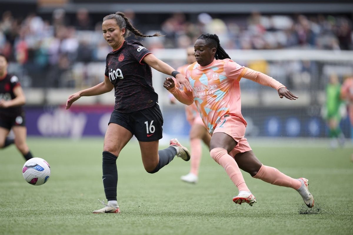 May 3, 2025; Portland, Oregon, USA; Portland Thorns FC defender Sam Hiatt (16) intercepts the ball during the first half against Orlando Pride forward Barbra Banda (22) at Providence Park. Mandatory Credit: Troy Wayrynen-Imagn Images