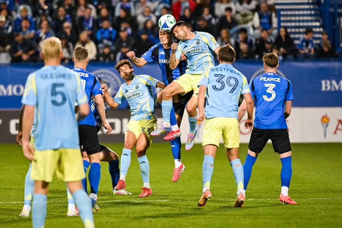 May 3, 2025; Montreal, Province of Quebec, CAN; CF Montreal defender Tom Pearce (3) and Philadelphia Union forward Tai Baribo (9) head the ball simultaneously during the first half at Saputo Stadium. Mandatory Credit: David Kirouac-Imagn Images