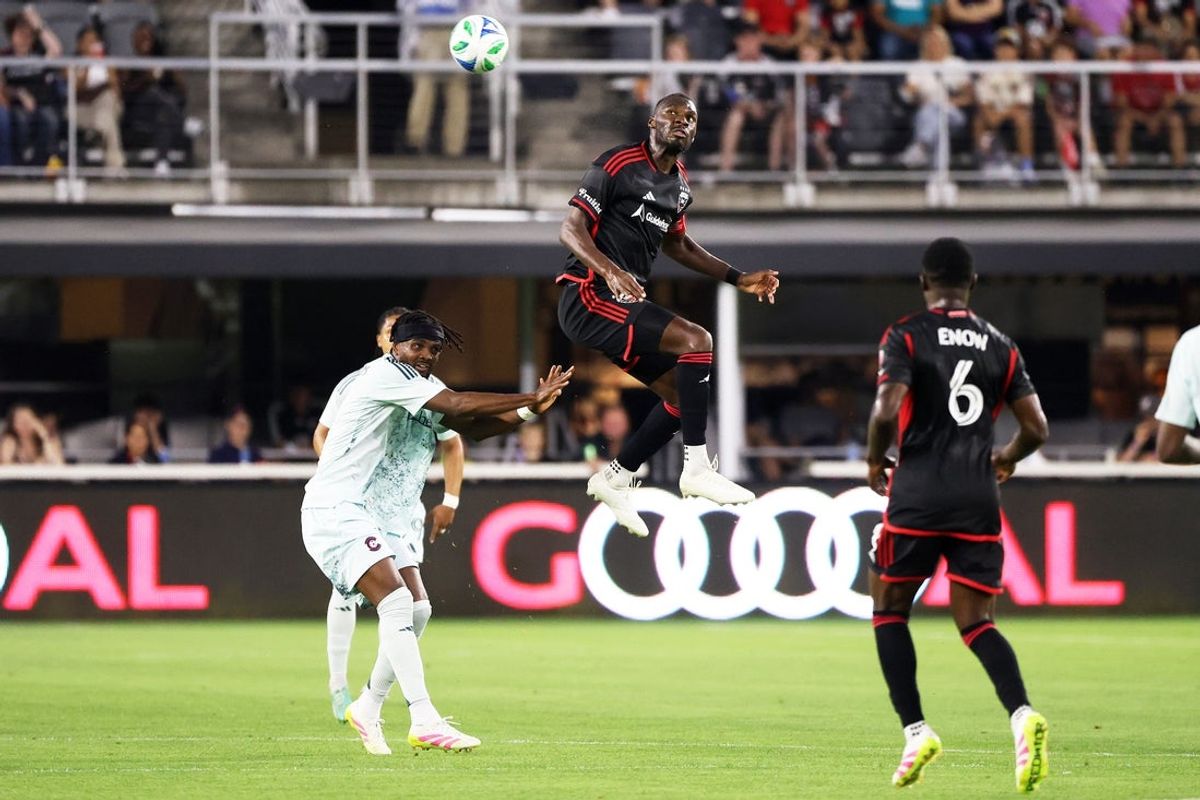 May 3, 2025; Washington, District of Columbia, USA; D.C. United forward Christian Benteke (20) heads the ball during the first half against the Colorado Rapids at Audi Field. Mandatory Credit: Daniel Kucin Jr.-Imagn Images