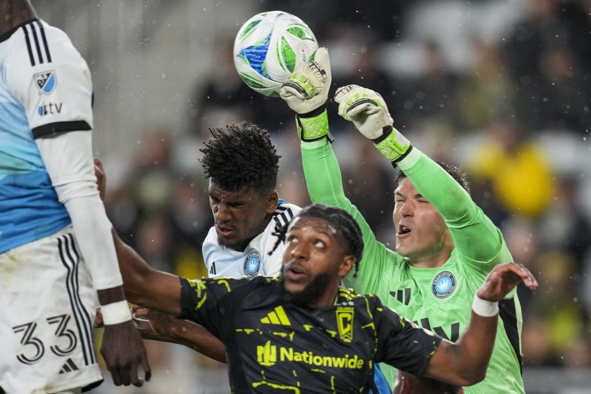May 3, 2025; Columbus, Ohio, USA; Charlotte FC goalkeeper Kristijan Kahlina (1) leaps as he makes a save against the Columbus Crew in the first half at Lower.com Field. Mandatory Credit: Aaron Doster-Imagn Images