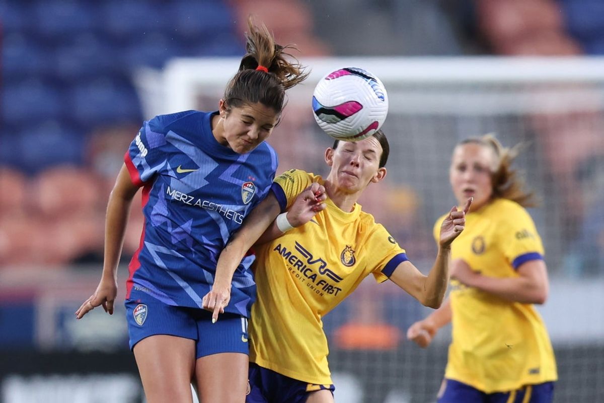 May 3, 2025; Sandy, Utah, USA; North Carolina Courage midfielder Riley Jackson (16) and Utah Royals forward Cece Kizer (25) play for a head ball during the first half at America First Field. Mandatory Credit: Rob Gray-Imagn Images
