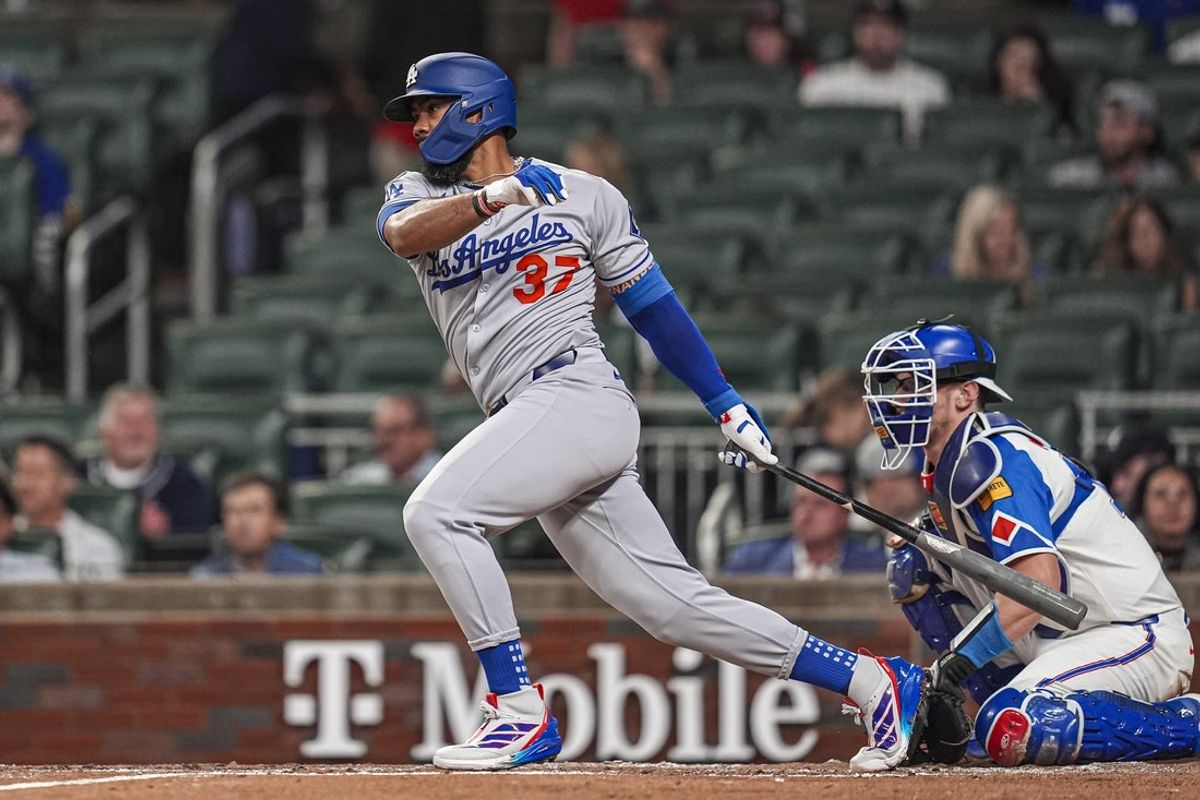 May 3, 2025; Cumberland, Georgia, USA; Los Angeles Dodgers right fielder Teoscar Hernandez (37) singles to drive in a run against the Atlanta Braves during the third inning at Truist Park. Mandatory Credit: Dale Zanine-Imagn Images