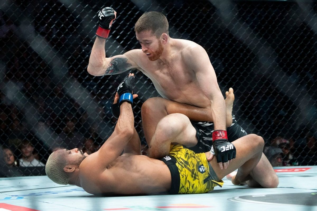 Cory Sandhagen (red gloves) fights with Deiveson Figueiredo (blue gloves) during UFC Fight Night at Wells Fargo Arena on May 3, 2025, in Des Moines.