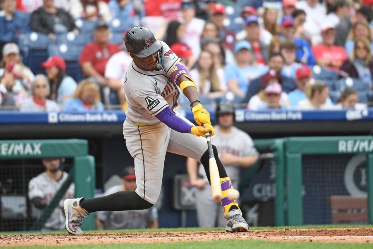 May 4, 2025; Philadelphia, Pennsylvania, USA; Arizona Diamondbacks shortstop Geraldo Perdomo (2) hits an RBI single during the fourth inning against the Philadelphia Phillies at Citizens Bank Park. Mandatory Credit: Eric Hartline-Imagn Images