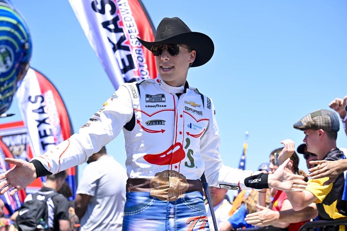 May 4, 2025; Fort Worth, Texas, USA; NASCAR Cup Series driver Carson Hocevar (77) is introduced before the start of the Wurth 400 race at Texas Motor Speedway. Mandatory Credit: Jerome Miron-Imagn Images