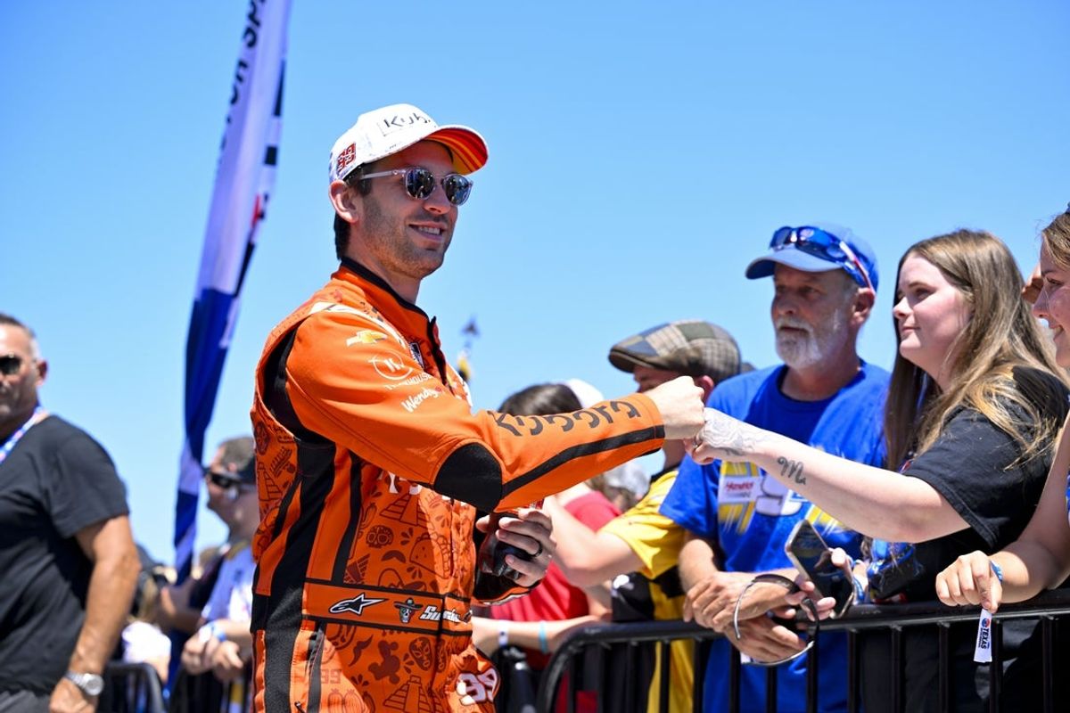May 4, 2025; Fort Worth, Texas, USA; NASCAR Cup Series driver Daniel Suarez (99) is introduced before the start of the Wurth 400 race at Texas Motor Speedway. Mandatory Credit: Jerome Miron-Imagn Images
