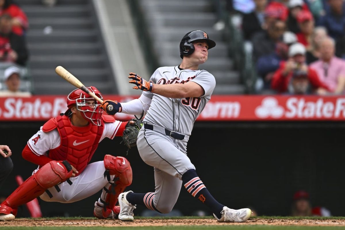 May 4, 2025; Anaheim, California, USA; Detroit Tigers outfielder Kerry Carpenter (30) hits a two RBI double against the Los Angeles Angels during the second inning at Angel Stadium. Mandatory Credit: Jonathan Hui-Imagn Images
