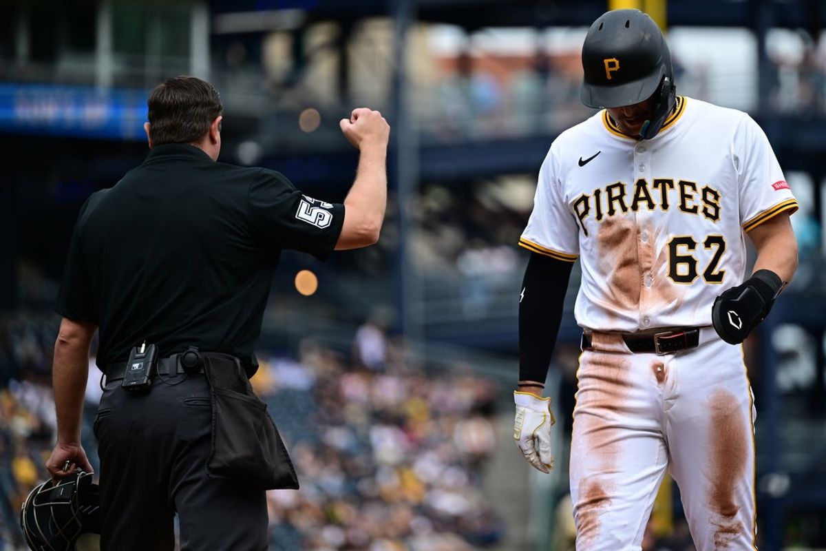 May 4, 2025; Pittsburgh, Pennsylvania, USA; Pittsburgh Pirates first basemen Matthew Gorski (62) reacts after being tagged out at home plate during the seventh inning against the San Diego Padres at PNC Park. Mandatory Credit: David Dermer-Imagn Images
