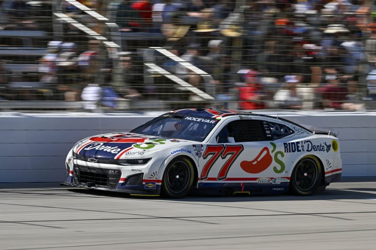 May 4, 2025; Fort Worth, Texas, USA; NASCAR Cup Series driver Carson Hocevar (77) drives during the Wurth 400 race at Texas Motor Speedway. Mandatory Credit: Jerome Miron-Imagn Images