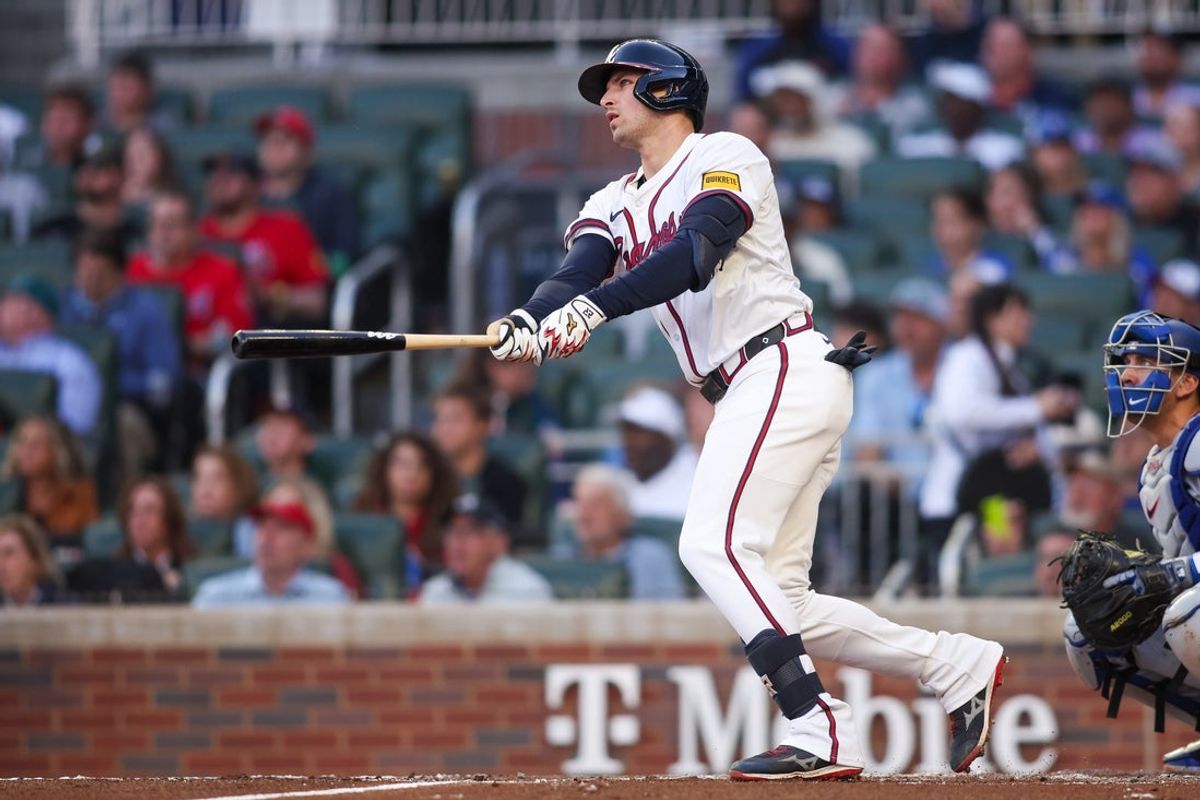 May 4, 2025; Atlanta, Georgia, USA; Atlanta Braves third baseman Austin Riley (27) hits a two-run home run against the Los Angeles Dodgers in the third inning at Truist Park. Mandatory Credit: Brett Davis-Imagn Images