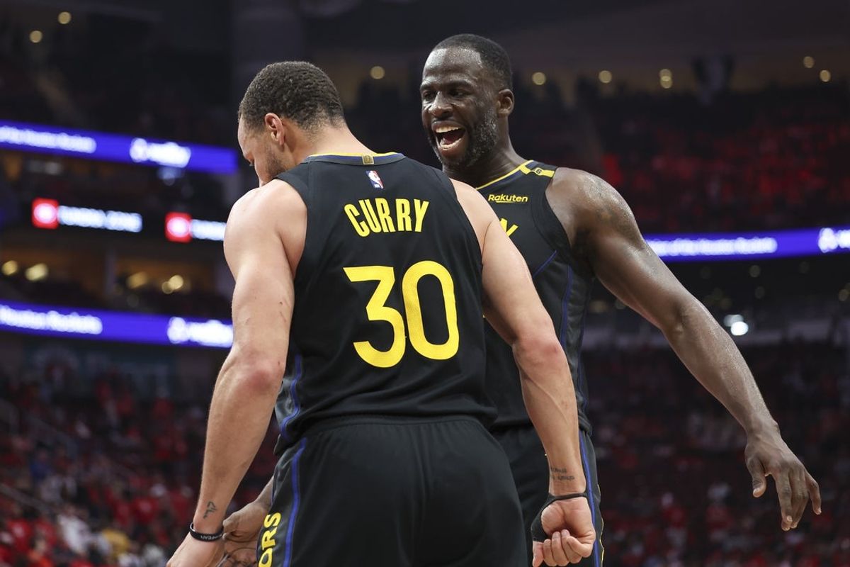 May 4, 2025; Houston, Texas, USA; Golden State Warriors forward Draymond Green (23) celebrates with guard Stephen Curry (30) during game seven of the first round for the 2025 NBA Playoffs against the Houston Rockets at Toyota Center. Mandatory Credit: Troy Taormina-Imagn Images