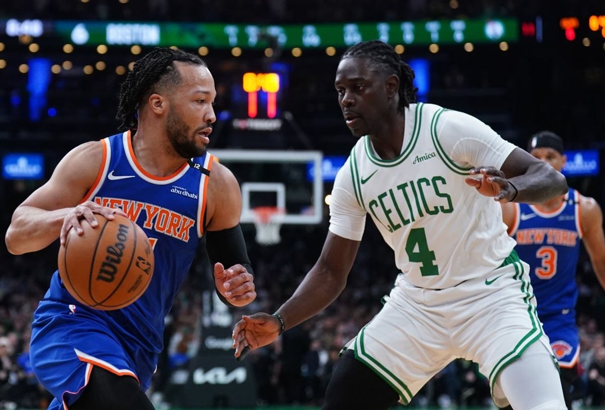 May 5, 2025; Boston, Massachusetts, USA; New York Knicks guard Jalen Brunson (11) drives the ball against Boston Celtics guard Jrue Holiday (4) in the first quarter during game one of the second round for the 2025 NBA Playoffs at TD Garden. Mandatory Credit: David Butler II-Imagn Images