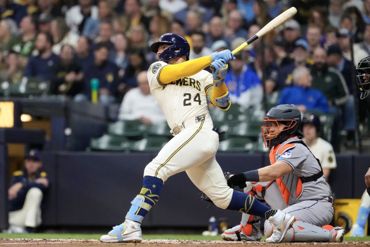 May 5, 2025; Milwaukee, Wisconsin, USA;  Milwaukee Brewers catcher William Contreras (24) hits an RBI single during the third inning against the Houston Astros at American Family Field. Mandatory Credit: Jeff Hanisch-Imagn Images