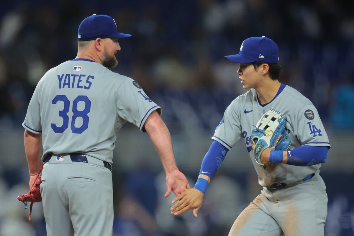 May 5, 2025; Miami, Florida, USA; Los Angeles Dodgers second baseman Hyeseong Kim (6) celebrates with relief pitcher Kirby Yates (38) after the game against the Miami Marlins at loanDepot Park. Mandatory Credit: Sam Navarro-Imagn Images