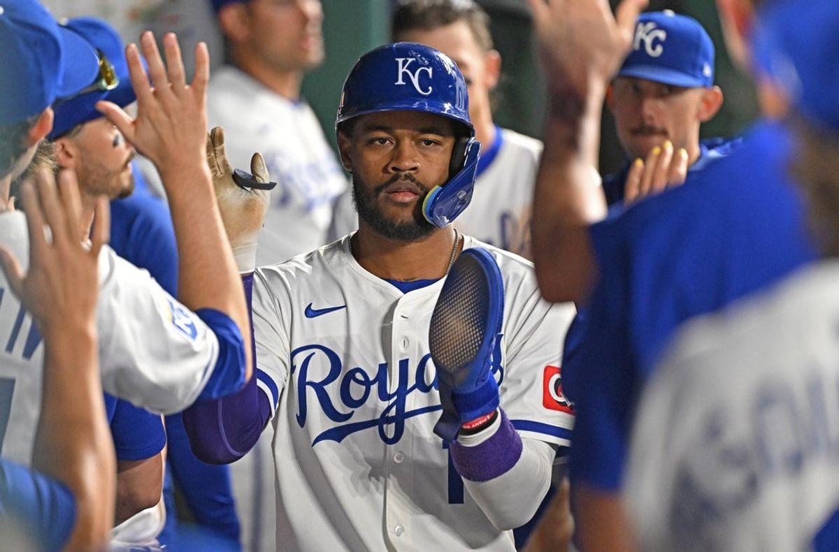 May 5, 2025; Kansas City, Missouri, USA;  Kansas City Royals third baseman Maikel Garcia (11) celebrates in the dugout after scoring a run in the eighth inning against the Chicago White Sox at Kauffman Stadium. Mandatory Credit: Peter Aiken-Imagn Images