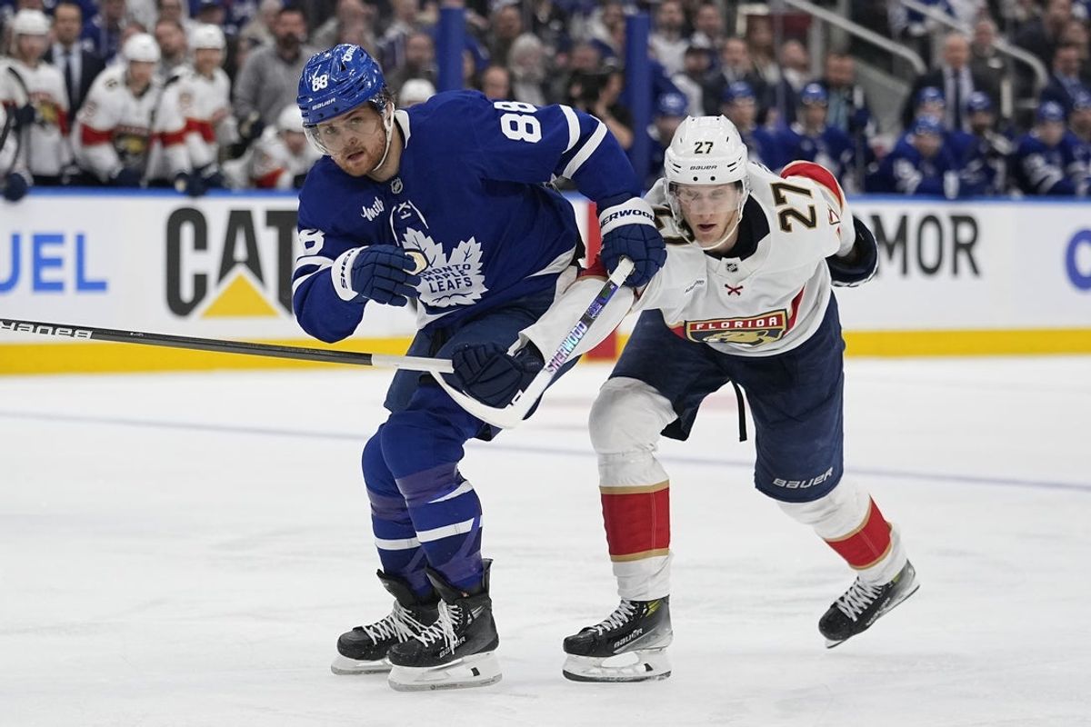May 5, 2025; Toronto, Ontario, CAN; Toronto Maple Leafs forward William Nylander (88) and Florida Panthers forward Eetu Luostarinen (27) battle for position during the third period of the second round of the 2025 Stanley Cup Playoffs at Scotiabank Arena. Mandatory Credit: John E. Sokolowski-Imagn Images
