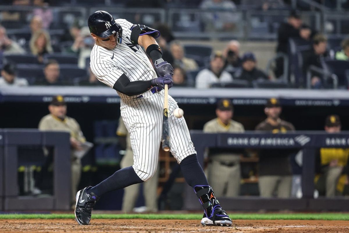 May 6, 2025; Bronx, New York, USA;  New York Yankees right fielder Aaron Judge (99) hits a solo home run in the fourth inning against the San Diego Padres at Yankee Stadium. Mandatory Credit: Wendell Cruz-Imagn Images